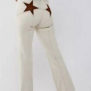 Free People we the free firecracker flare jeans. With Brown Star Accents